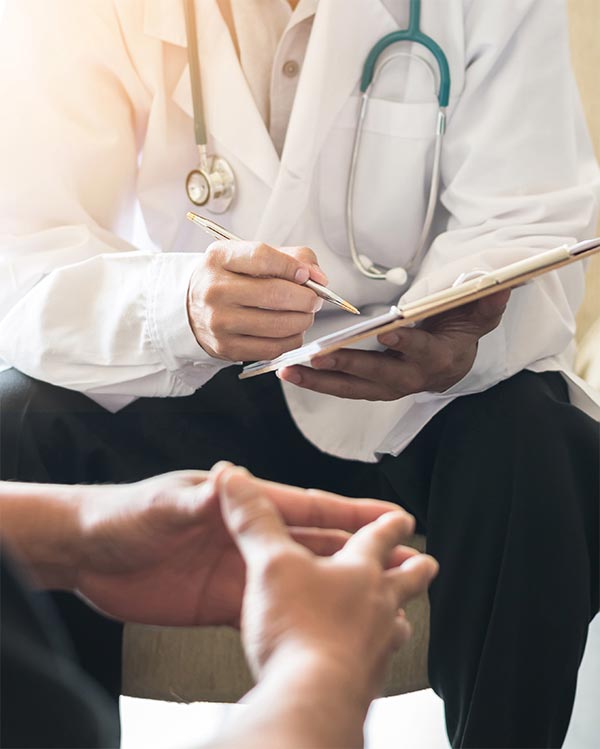 Caring doctor with a patient during a clinical research trial.