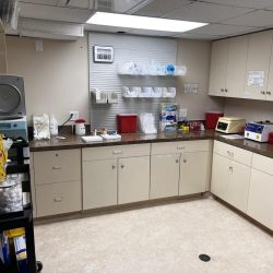 Clinical research center biochemestry analyzer room designed for clinical trial use stocked with requisite laboratory supplies in close proximity to participants.